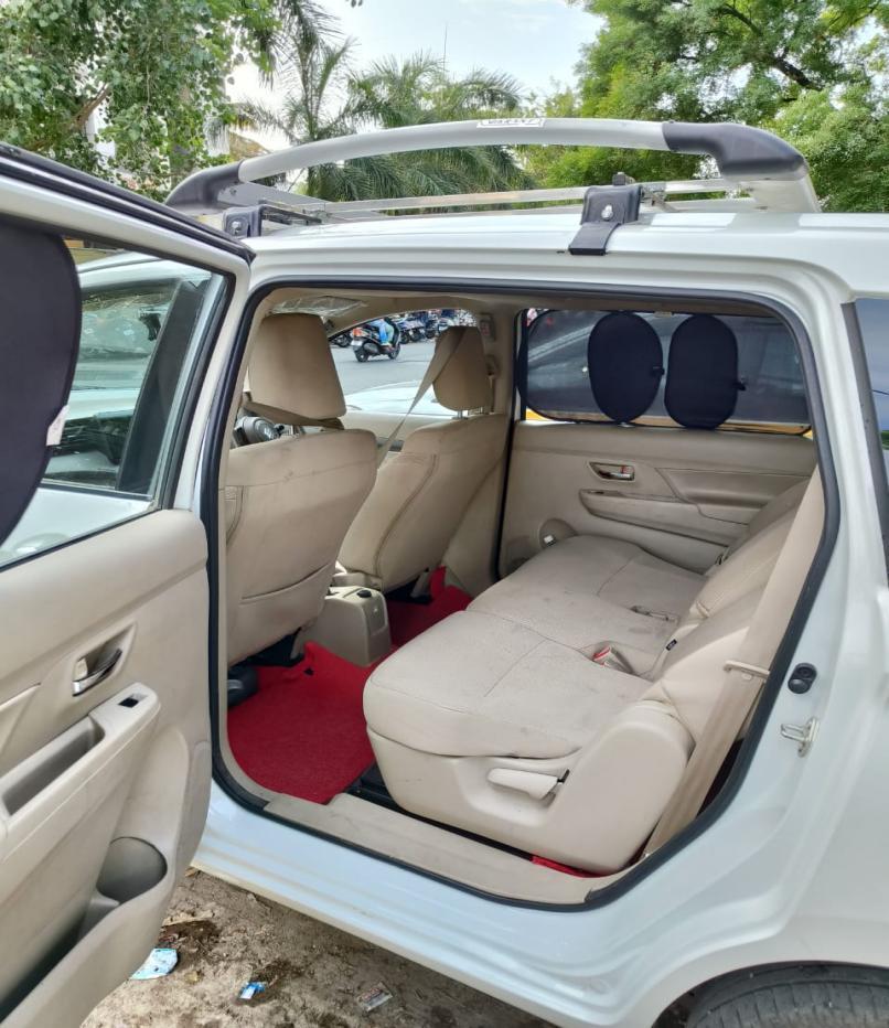 Spacious Innova Crysta interior with roof carrier for luggage